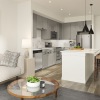 A modern kitchen with stainless appliances and kitchen island at Prospect's south Austin apartments.