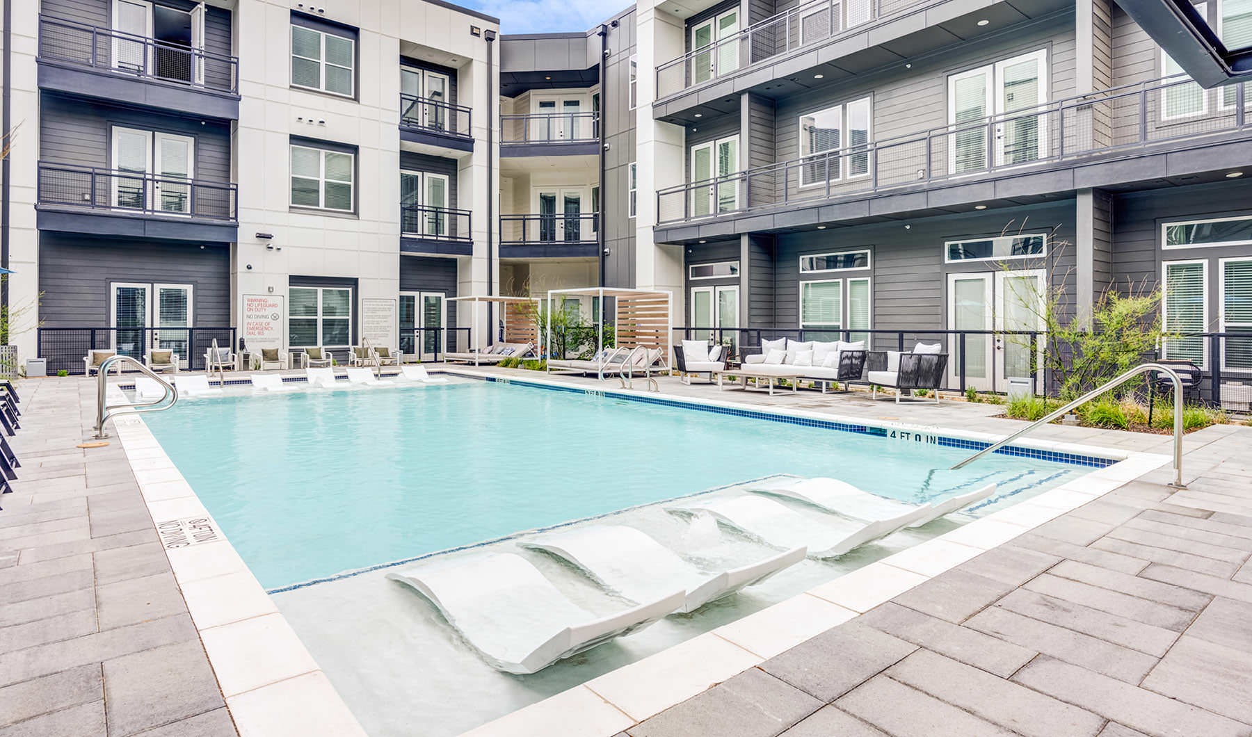 Settle into comfort at Prospect swimming pool with tanning ledge