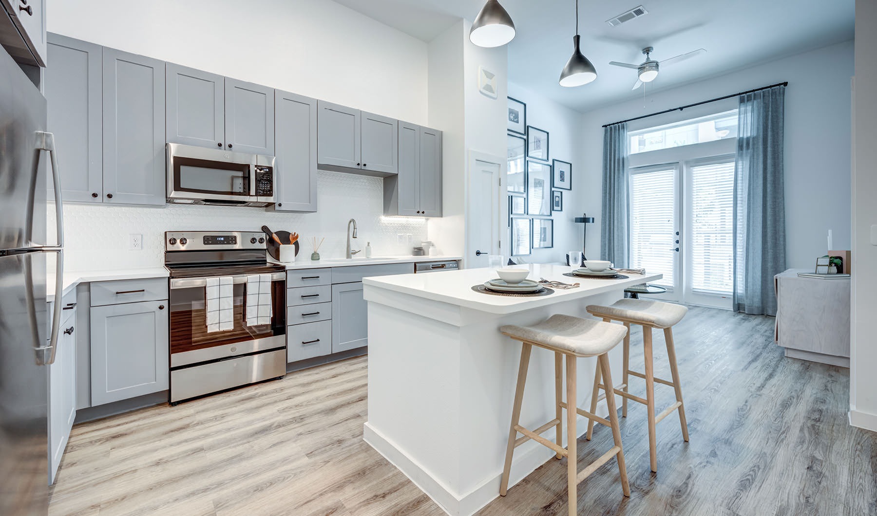 A perfect fit for the whole family open kitchen with island and under cabinet lighting